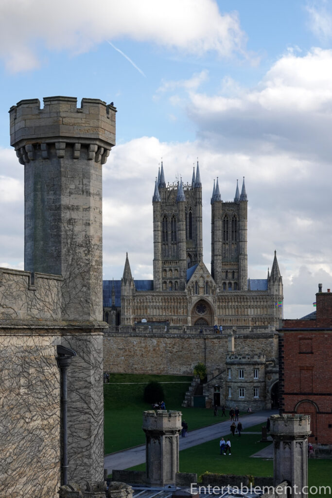 View of Lincoln Castle’s medieval stone ramparts and inner green, highlighting its Norman origins