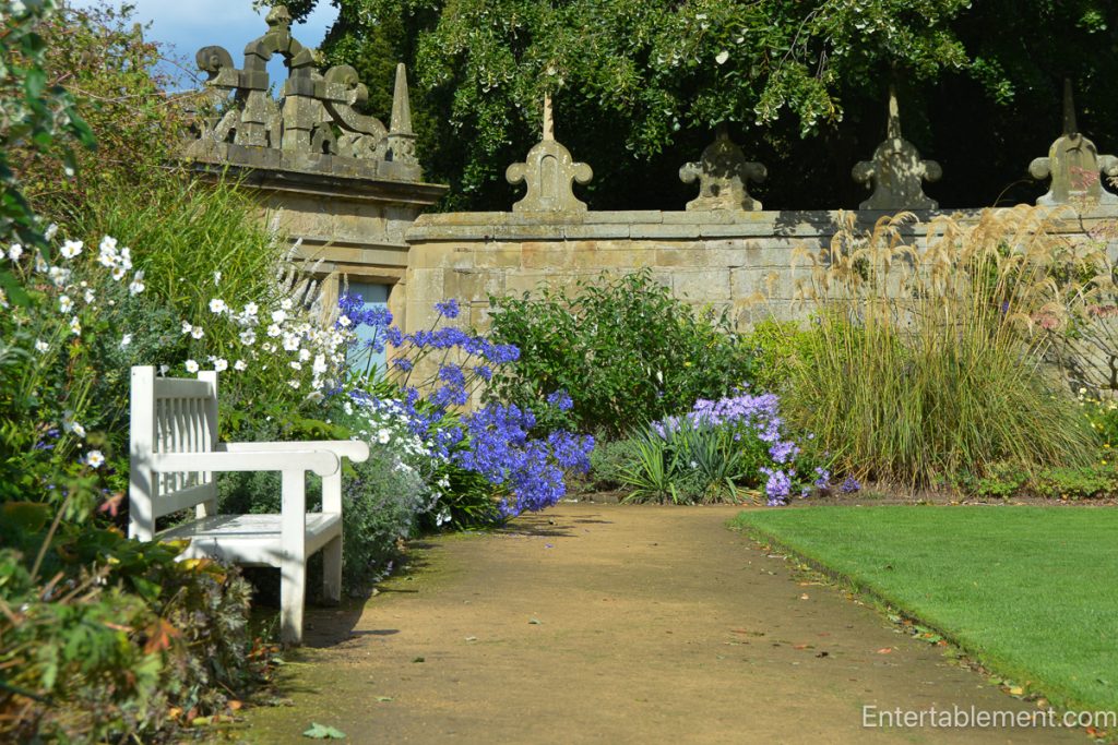 View of the formal gardens at Hardwick Hall, featuring manicured lawns and topiary.”