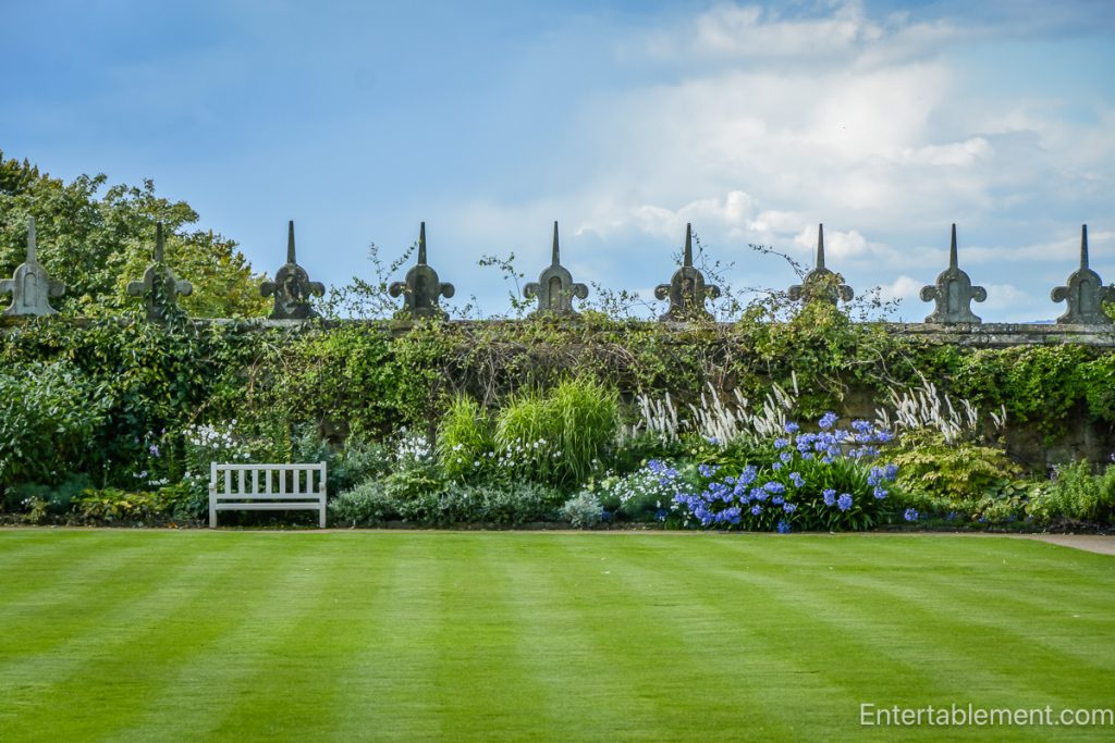 View of the formal gardens at Hardwick Hall, featuring manicured lawns and topiary.”