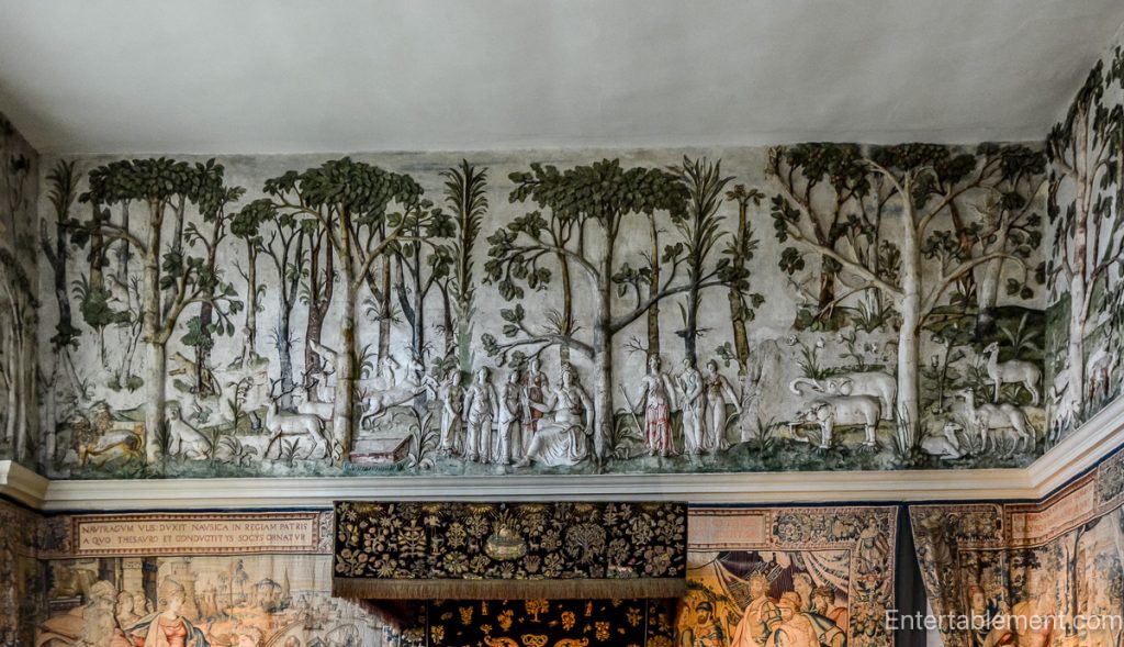 The High Great Chamber at Hardwick Hall, adorned with plaster friezes depicting hunting scenes and a grand fireplace.