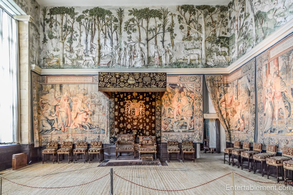 The High Great Chamber at Hardwick Hall, adorned with plaster friezes depicting hunting scenes and a grand fireplace.