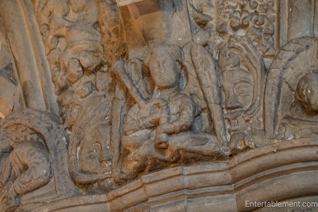 Carved stone angel playing bagpipes at Rosslyn Chapel.