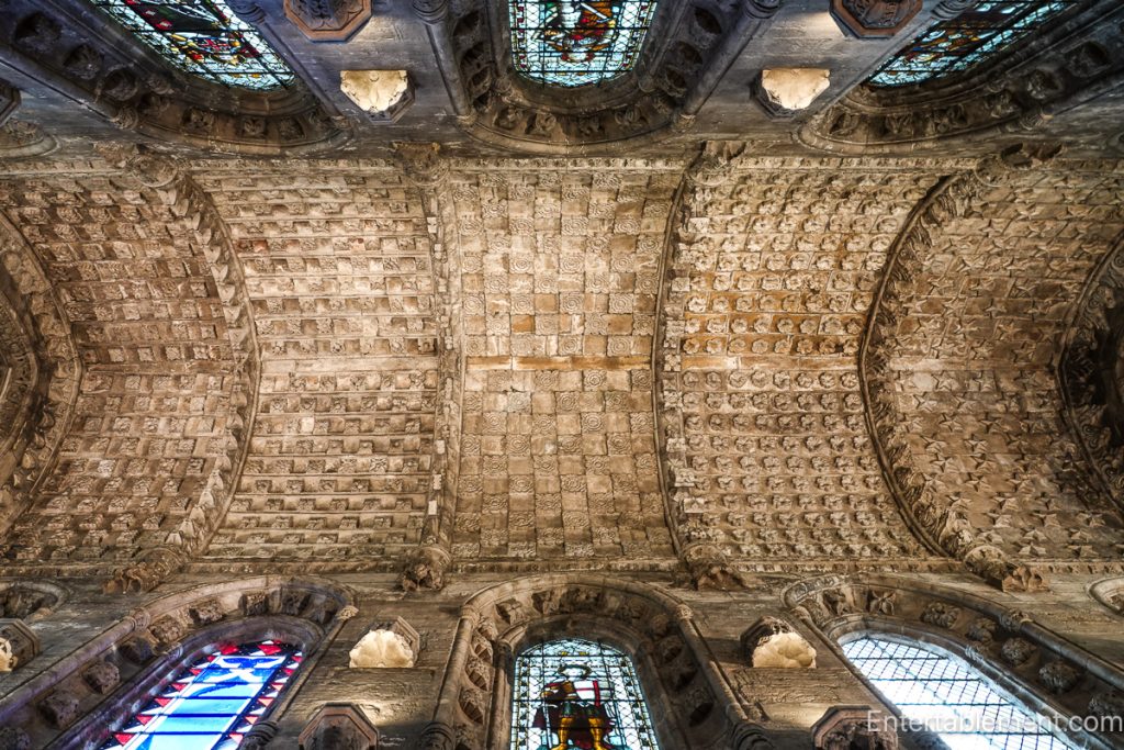 Stone ceiling of Rosslyn Chapel with geometric cube carvings and medieval patterns.