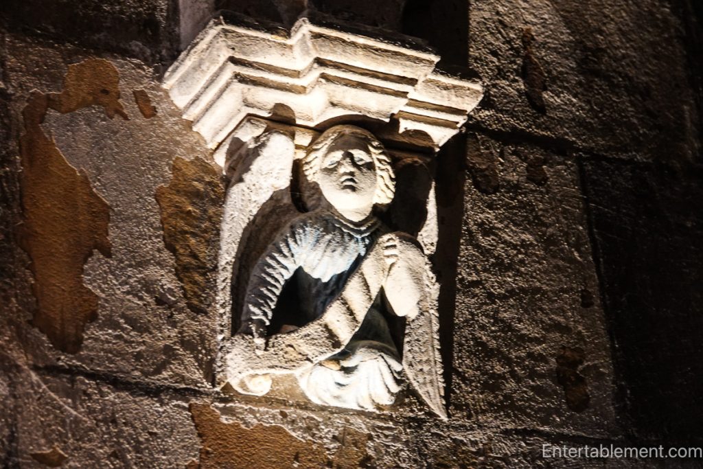 Intricate medieval stone angel inside Rosslyn Chapel.