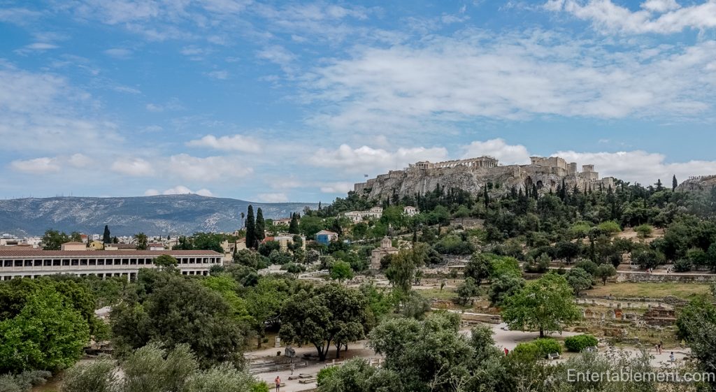 Ruins of the Ancient Agora in Athens, with scattered columns and stone pathways where civic life once took place.