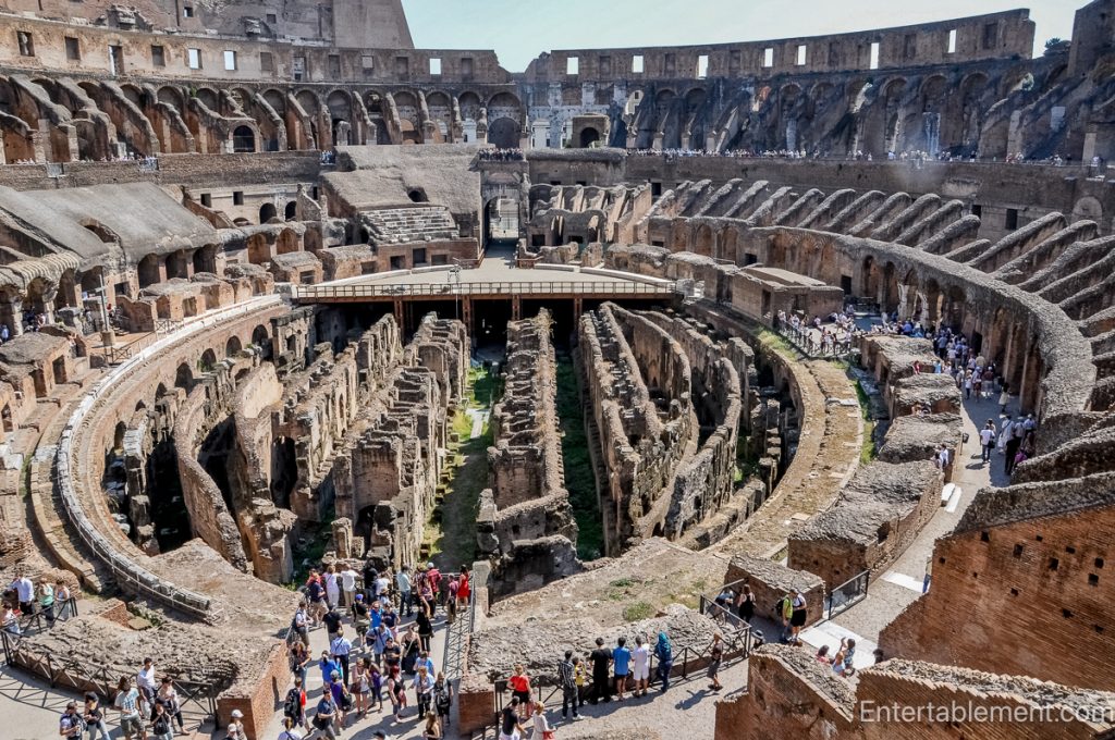 View down into the Colosseum’s hypogeum, revealing underground chambers, corridors, and reconstructed walkways.