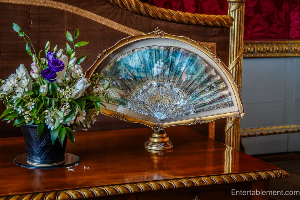 Colourful fan in state bedroom Holkham Hall, Norfolk