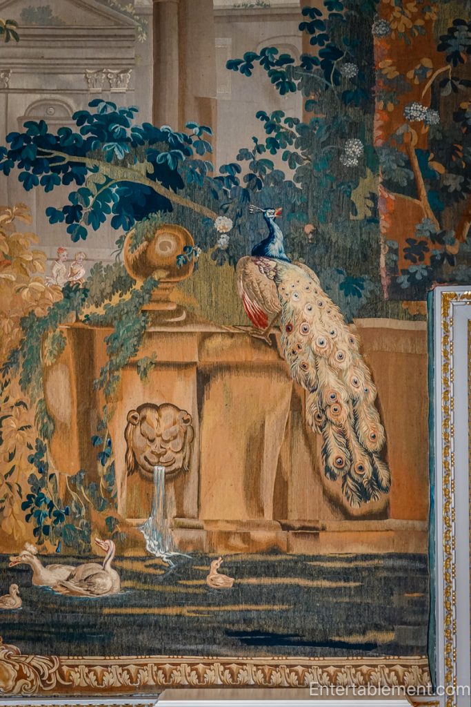 Tapestry detail with birds and floral motifs in Holkham Hall bathroom