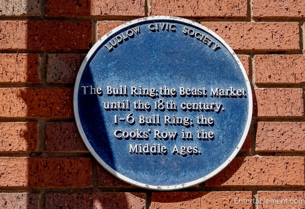 Ludlow Civic Society plaque explaining the medieval Beast Market and Cooks' Row