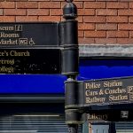 Direction signpost in Ludlow pointing to the castle, market, St Laurence's Church and other town landmarks
